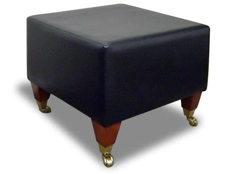 black leather ottoman with wood and brass feet