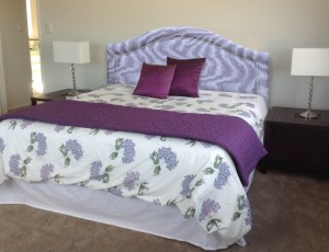 bed with curved top headboard